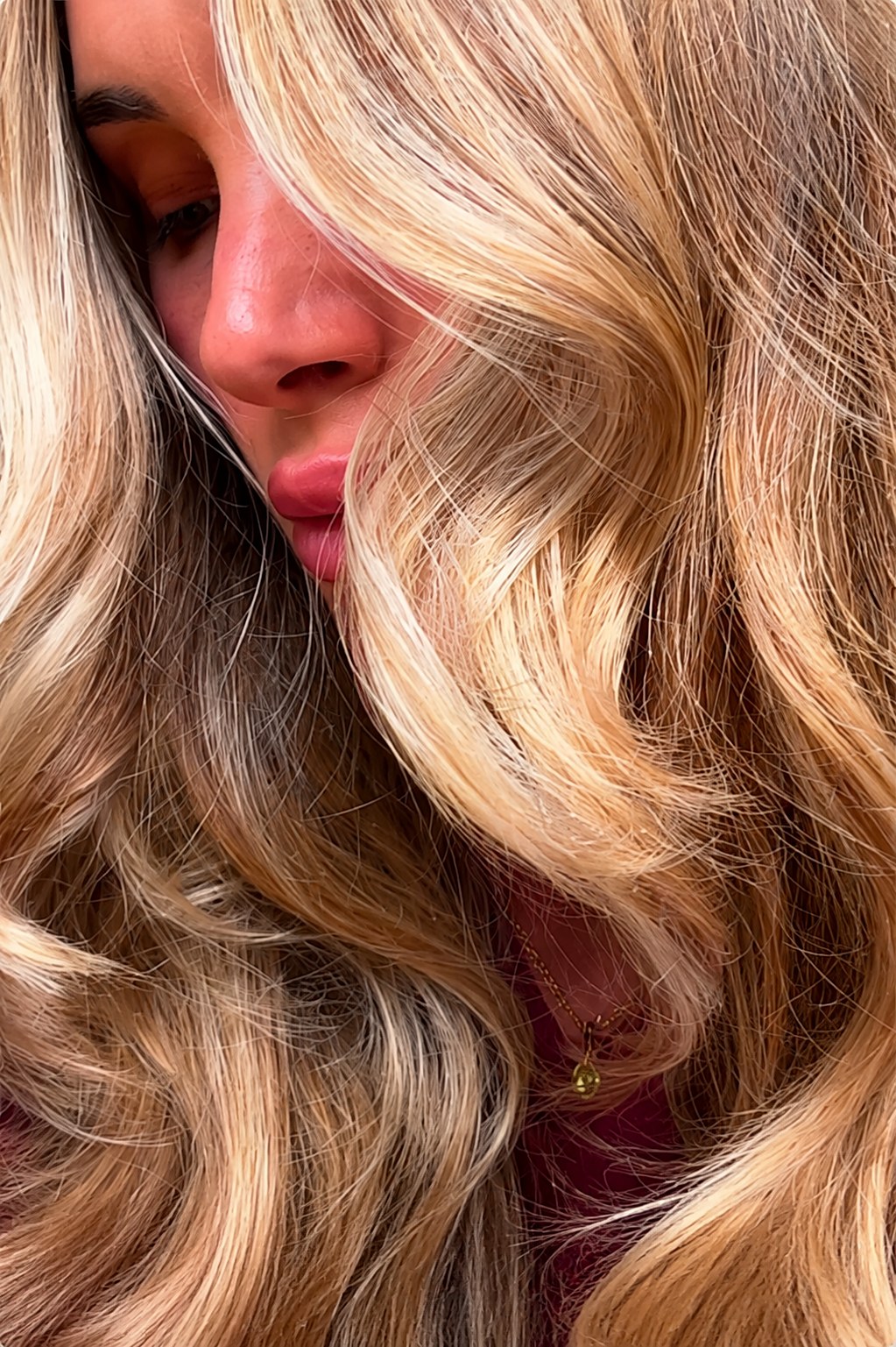 Editorial blonde waves framing the face — Touchée Organic Salon, Juno Beach