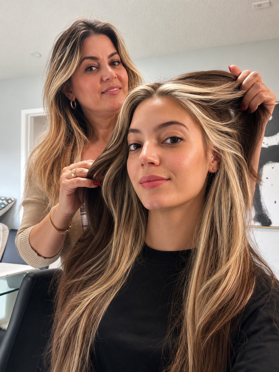 Janet checking a client's highlights at Touchée Organic Salon, Juno Beach, Florida