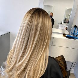 Buttery blonde with fine highlights, finished at the chair