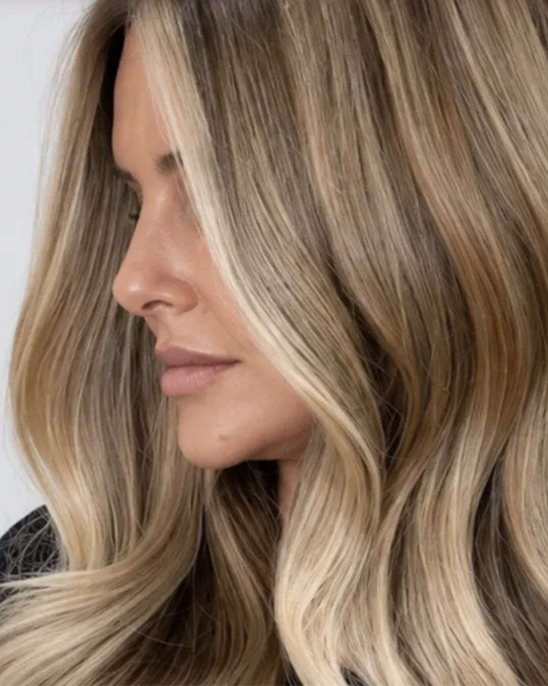 Blonde placed around the face so it grows out softly, Juno Beach