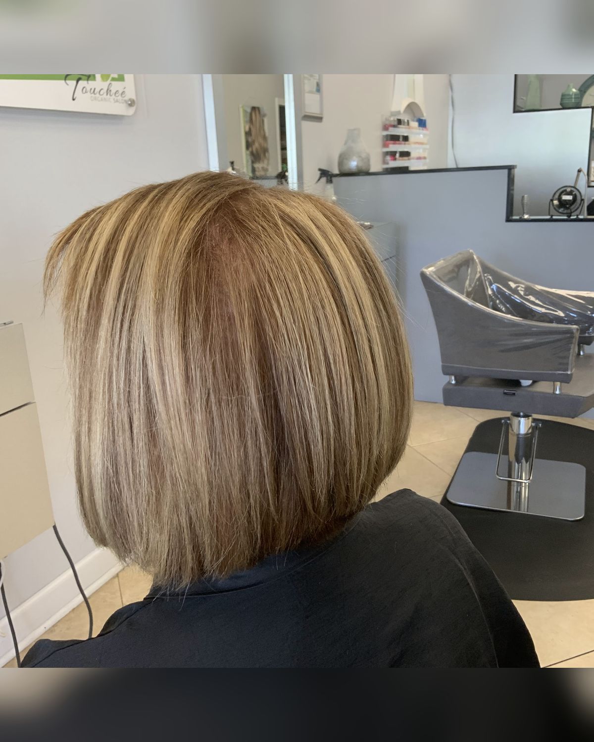 Dimensional blonde bob with a clean line — Touchée Organic Salon, Juno Beach