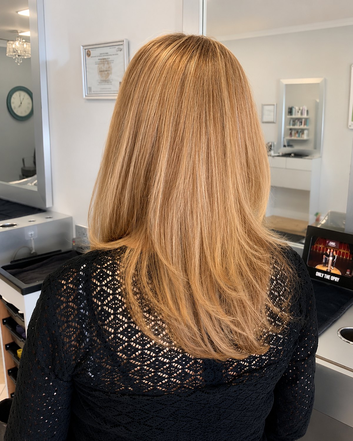Long blonde with layers cut through the interior — Touchée Organic Salon, Juno Beach