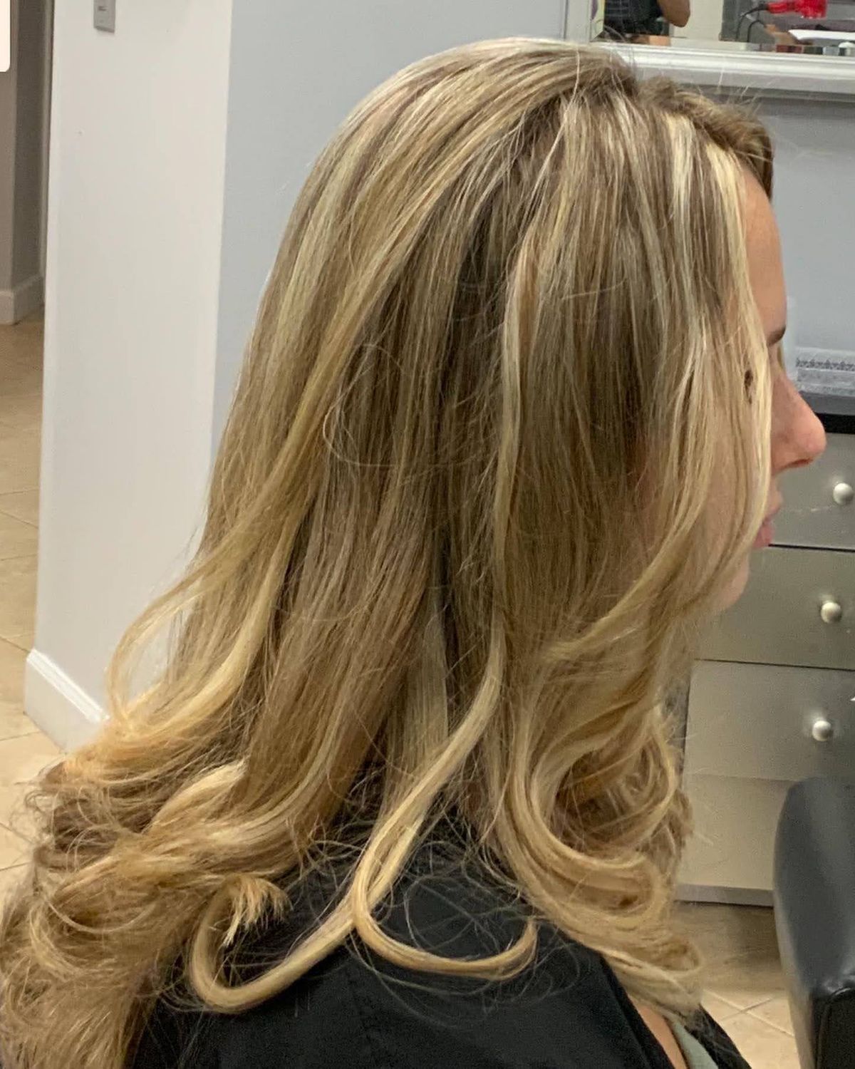 Long blonde layers with movement — Toucheé Organic Salon, Juno Beach