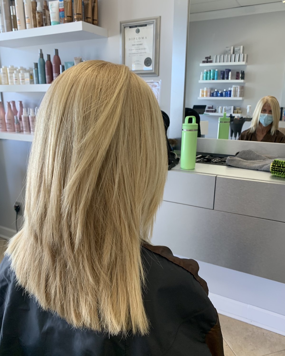 Long blonde layers, brightness kept through the lengths