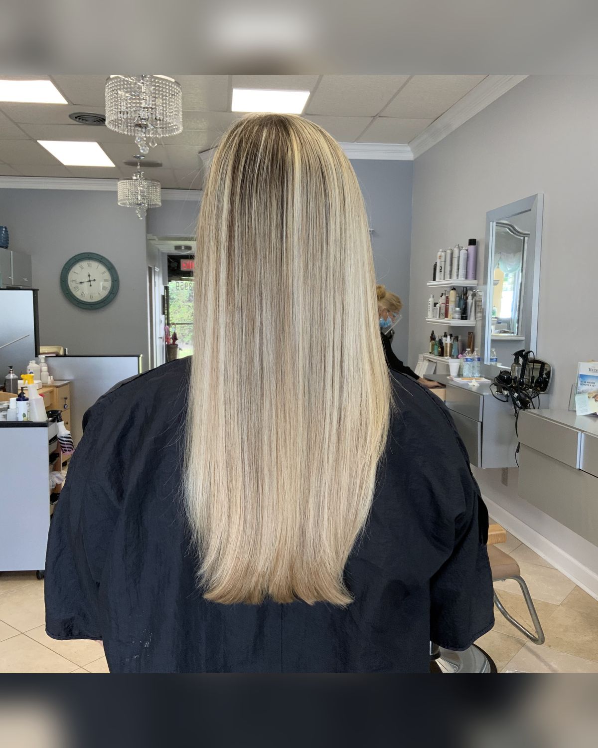 Long straight blonde balayage, grown out on purpose — Toucheé Organic Salon, Juno Beach