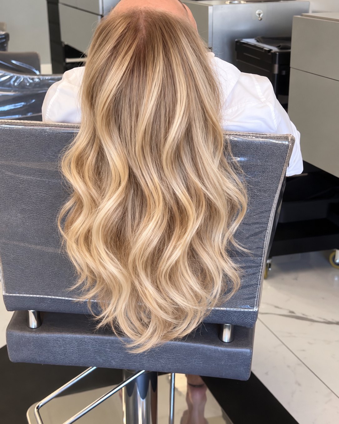 Long blonde waves with a soft shadowed root, set at the chair &mdash; Touche&eacute; Organic Salon, Juno Beach