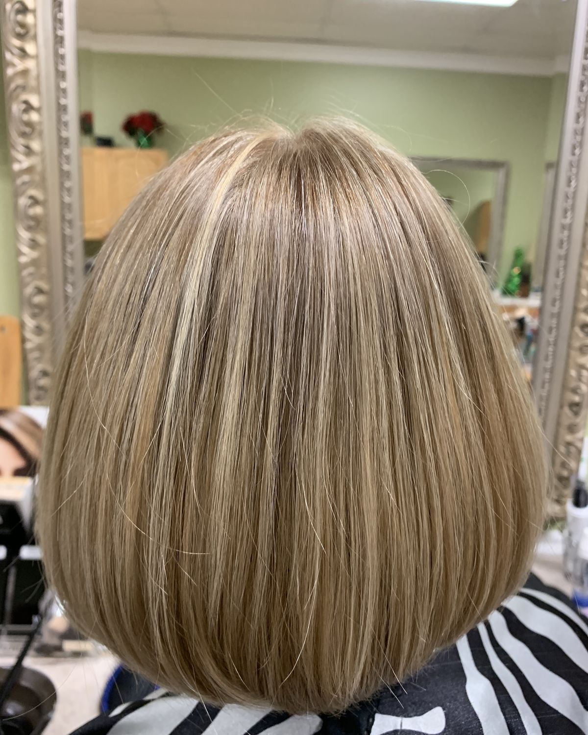 Bronde highlights worn straight and glossy — Toucheé Organic Salon, Juno Beach
