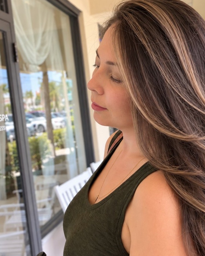 Dimensional brunette with blonde ribbons, photographed at the salon door — Toucheé Organic Salon, Juno Beach