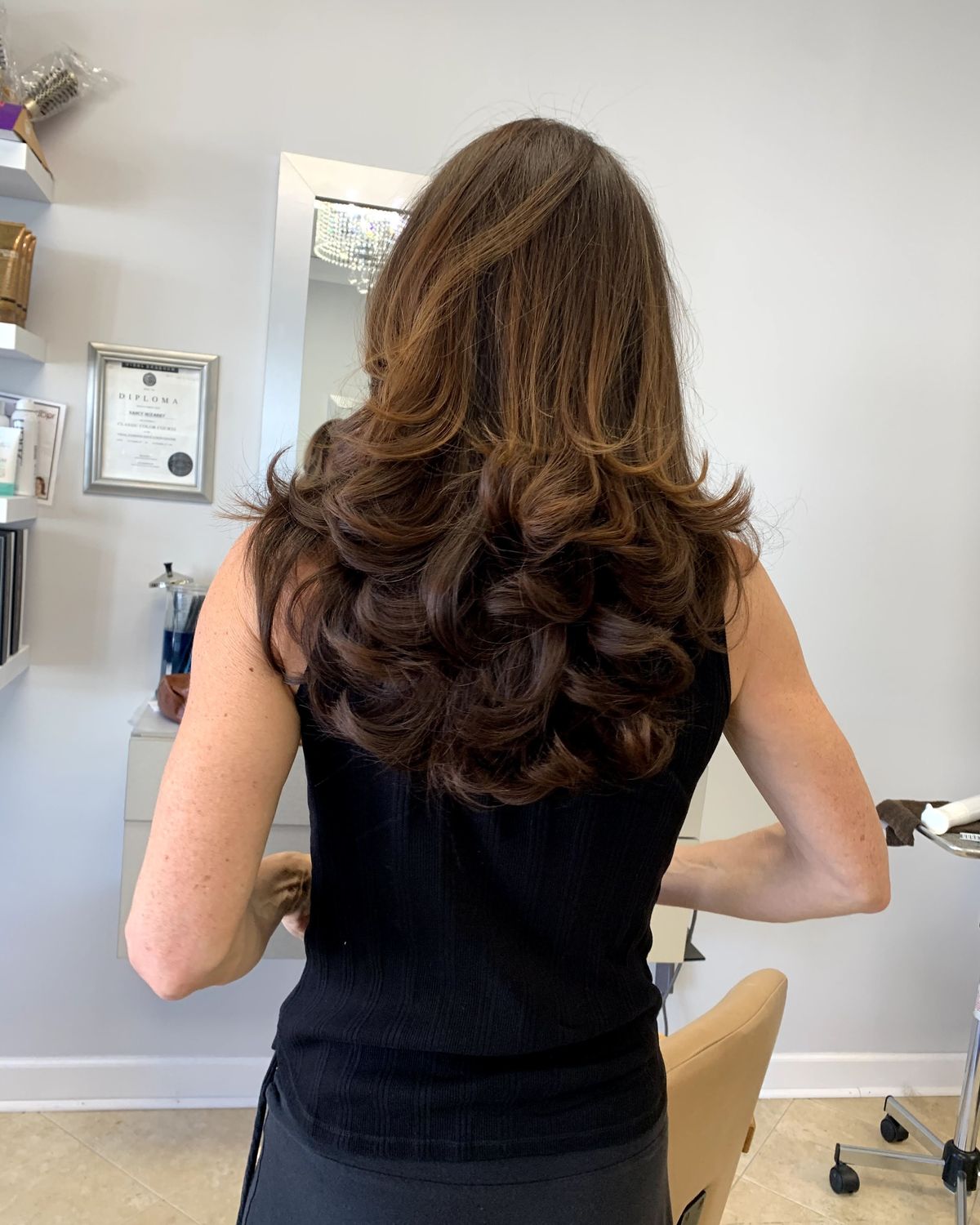 Rich brunette with curl through the lengths — Toucheé Organic Salon, Juno Beach