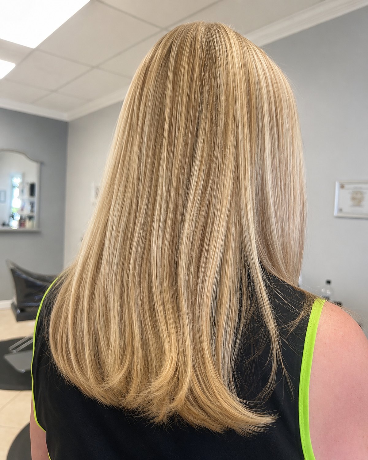 Buttercream blonde worn long — Touchée Organic Salon, Juno Beach
