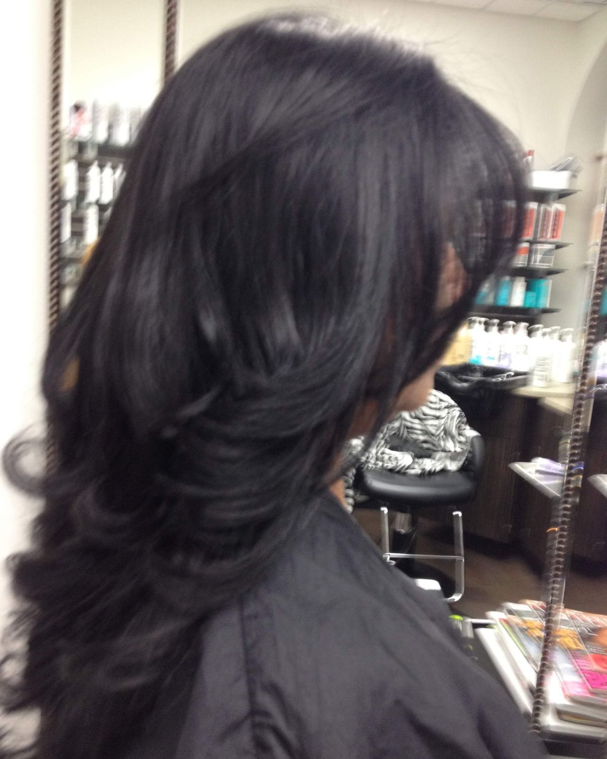 Near-black brunette with deep movement — Touchée Organic Salon, Juno Beach