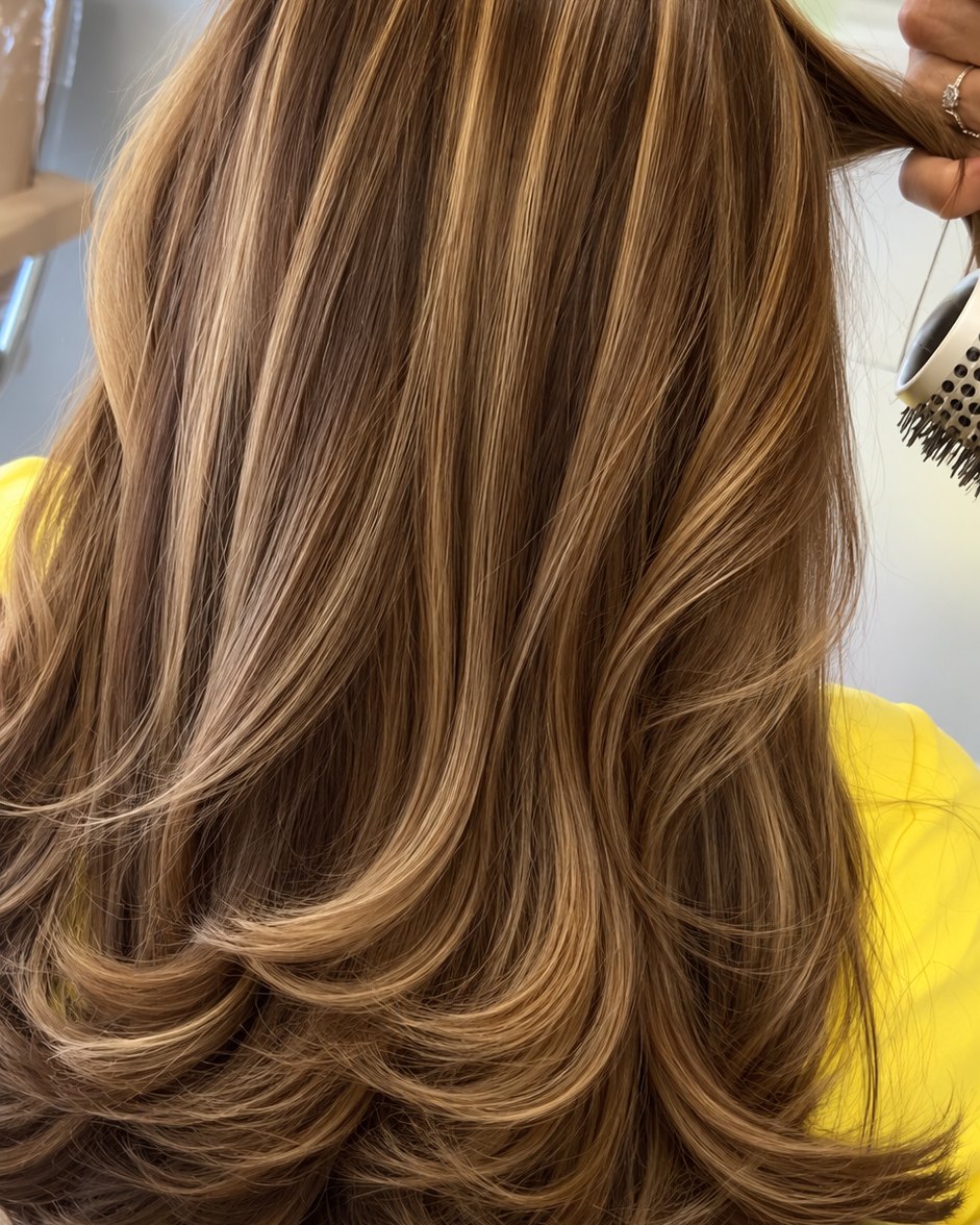 Brunette with caramel ribbons through the layers, finished with a blow-out — Toucheé Organic Salon, Juno Beach