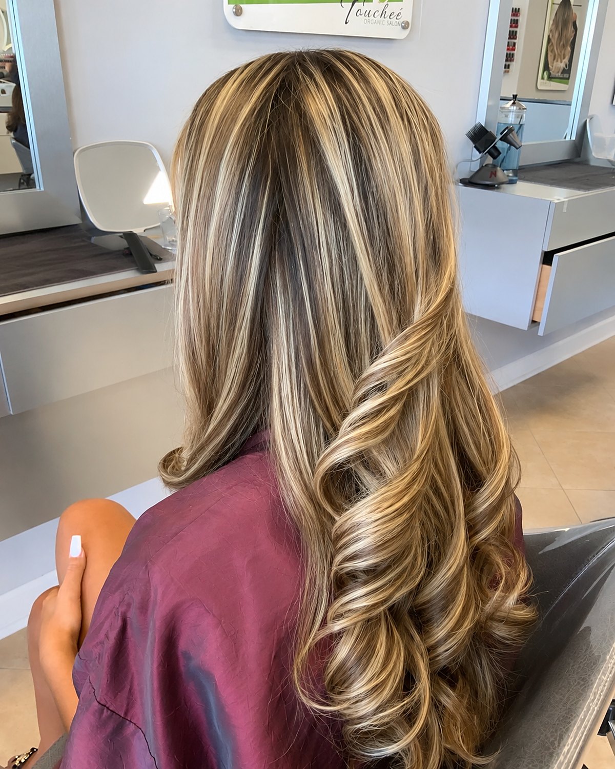 Golden toffee blonde — warm, expensive and deliberately low maintenance — Touchée Organic Salon, Juno Beach