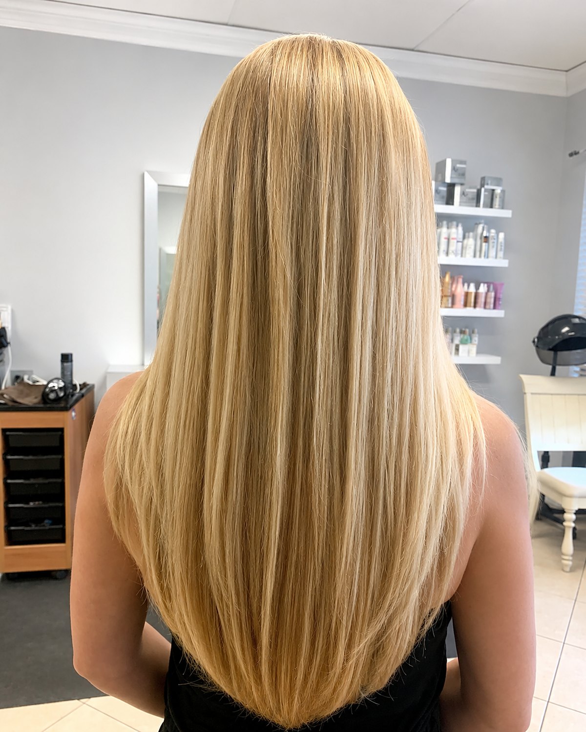 Honey butter blonde with warmth kept through the mid-lengths — Toucheé Organic Salon, Juno Beach