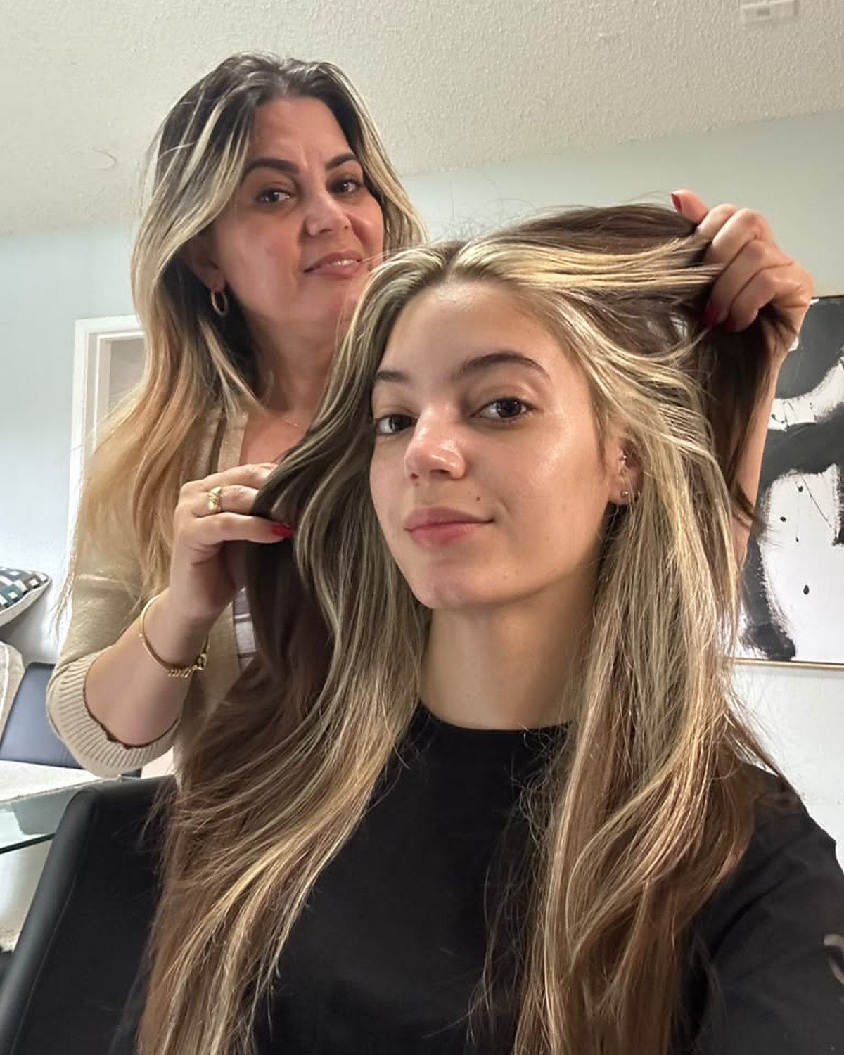 Janet placing a money piece through the face frame — Toucheé Organic Salon, Juno Beach