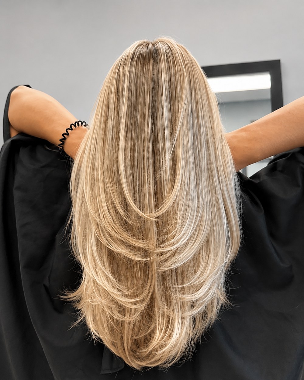 Long blonde with French highlights and layers cut through the interior — Touchée Organic Salon, Juno Beach