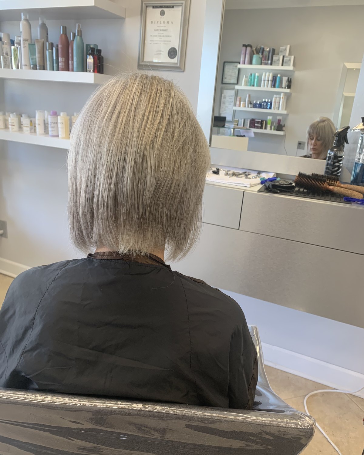 Platinum bob from behind, blunt through the ends