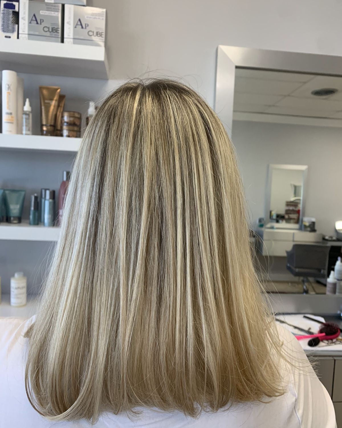 Platinum brightness blended through blonde at shoulder length — Touchée Organic Salon, Juno Beach