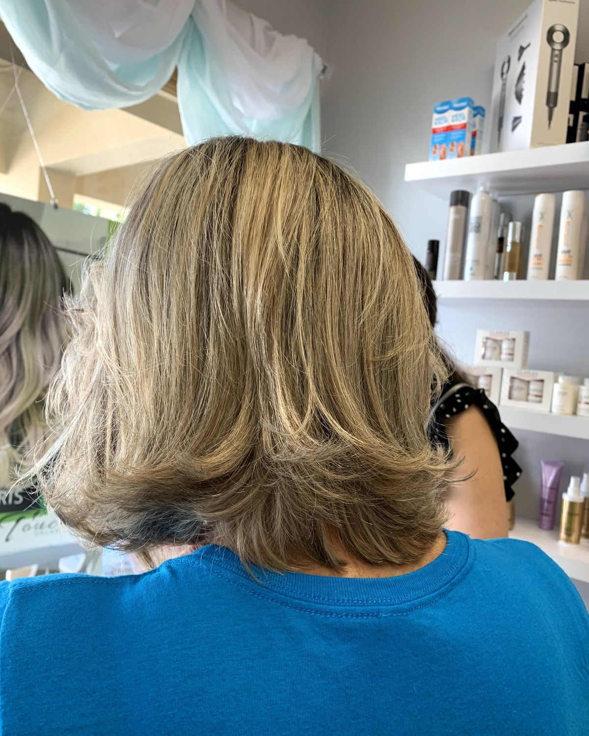 Icy platinum blended through to shoulder length — Toucheé Organic Salon, Juno Beach
